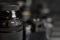 Sigma 24-105 f4 Art lens with Canon EOS R photocamera and other Canon lenses on black wooden table. Photography equipment by Sigma