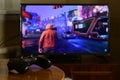 KHARKOV, UKRAINE - NOVEMBER 12, 2020: Video game controller Gamesir g3s on table with Watch Dogs Legion game on display