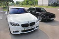 Kharkov, Ukraine. September, 2017; Combo BMW. Two BMW M5 - black and white. BMW M5 F10 and M5 E34 in the city Royalty Free Stock Photo