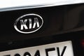 KIA brand logo on a black car background, emblem, symbol close-up Royalty Free Stock Photo