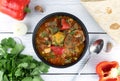 Khashlama - meat stew of beef or lamb meat with vegetables, lavash on a gray background. Armenian and Georgian cuisine.