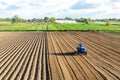 Kherson oblast, Ukraine - May 28, 2020: A farmer cultivates the soil on the site. Milling soil, crushing before cutting rows.