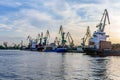 Port cranes and cargo ships in the Kherson port. View from the Dnieper River to the coastline