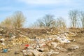 KHERSON, UKRAINE - MARCH 28, 2020: Heaps of garbage in the forest. Illegal garbage dump in nature. Environmental and air pollution Royalty Free Stock Photo