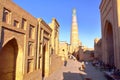 KHIVA, UZBEKISTAN - MAY 6, 2011: An alley inside Khiva old town with The Islam Khodja minaret in the background