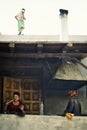 Ladies making bread at their front door