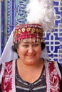 KHIVA, UZBEKISTAN - MAY 4, 2011: Traditionally dressed Uzbek woman posing at Tosh Hovli palace