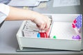 A nurse takes a medical test tube for taking blood from a vein, diagnoses the disease, tests for coronavirus