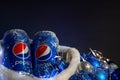 Khmelnytskyi, Ukraine - December 13, 2019: iron bottle of pepsi drink on a black background. The concept of the new 2020, Royalty Free Stock Photo