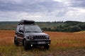 Khmelnytskyi, Ukraine - September 16, 2023: Suzuki Jimny off-road vehicle, dark gray colour, roof rack Niken, autumn day,