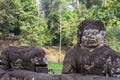 Khmer man mossy stone statue. Angkor Wat temple, Cambodia. Whole and headless human statue