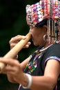 Khmu hilltribe playing flute with nose.