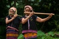Khmu hilltribe playing flute with nose.