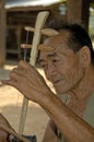 Khmu man playing instrument Laos