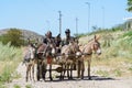 Donkey cart arrives at country stop to collect school children