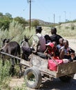 Donkey cart arrives at country stop to collect school children