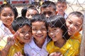 Khon Kaen,Thailand June 9, 2011 group of joyful asian kids posing from net of schoolyard