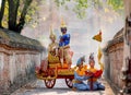 Khon Thai classic masked from the Ramakien with characters of woman and blue monkey stay together on traditional chariot in front