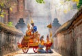 Khon or traditional Thai classic masked from the Ramakien characters woman and blue monkey stay together on traditional chariot in Royalty Free Stock Photo