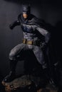 Batman figure standing gracefully on black background. Batman is a popular line of