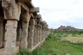 Khrisna Bazaar, pillars, and a pond in Hampi. Royalty Free Stock Photo