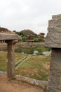 Khrisna Bazaar, pillars, and a pond in Hampi. Royalty Free Stock Photo