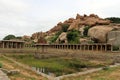 Khrisna Bazaar, pillars, and a pond in Hampi. Royalty Free Stock Photo