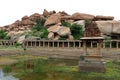 Khrisna Bazaar, pillars, and a pond in Hampi. Royalty Free Stock Photo