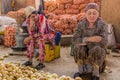 KHUJAND, TAJIKISTAN - MAY 7, 2018: Onion sellers at Panchsanbe Panjshanbe Bazaar market in Khujand, Tajikist