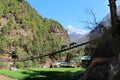 Khumbila Mountain in the background and suspension bridge in the foreground in Nepal