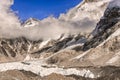 Khumbutse peak coming out of clouds over Khumbu Glacier in Nepal near Everest Base camp Royalty Free Stock Photo