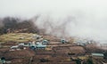 Khumjung Village View with heavy clouds over settlement . Everest Base Camp EBC trekking route. Sagarmatha National Park, Nepal