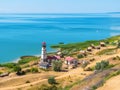 Khutor Merzhanovo, Rostov region, Russia - August 3, 2020: coast of the Azov sea, resting place - huts and a lighthouse