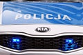 Kia Seed polish police car at the city street.