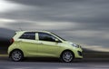 Kia is a small green car. Royalty Free Stock Photo