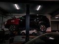 Kia sportage in oil change process lifted up floating car