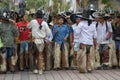 Kichwa men wearing leather chaps