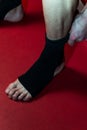 Kick Boxer Putting Straps On His Foot