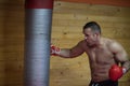 Kick boxer training on a punching bag