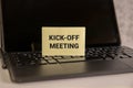 Kick-off meeting Message. open notepad with text on a rustic background. Royalty Free Stock Photo