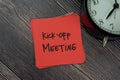 Kick-off Meeting write on sticky notes isolated on Wooden Table