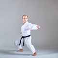 A kick is trained by an athlete in a formal karate exercise