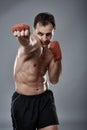 Kickbox fighter on gray background Royalty Free Stock Photo