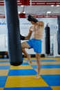 Kickbox fighter training with the punch bag Royalty Free Stock Photo