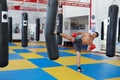 Kickbox fighter training with the punch bag Royalty Free Stock Photo