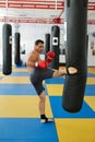 Kickbox fighter training with the punch bag Royalty Free Stock Photo