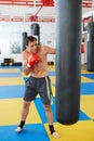 Kickbox fighter training with the punch bag Royalty Free Stock Photo