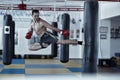 Kickbox fighter training with the punch bag Royalty Free Stock Photo