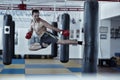 Kickbox fighter training with the punch bag