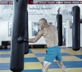 Kickbox fighter training with the punch bag Royalty Free Stock Photo